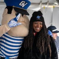 louie the laker poses with woman